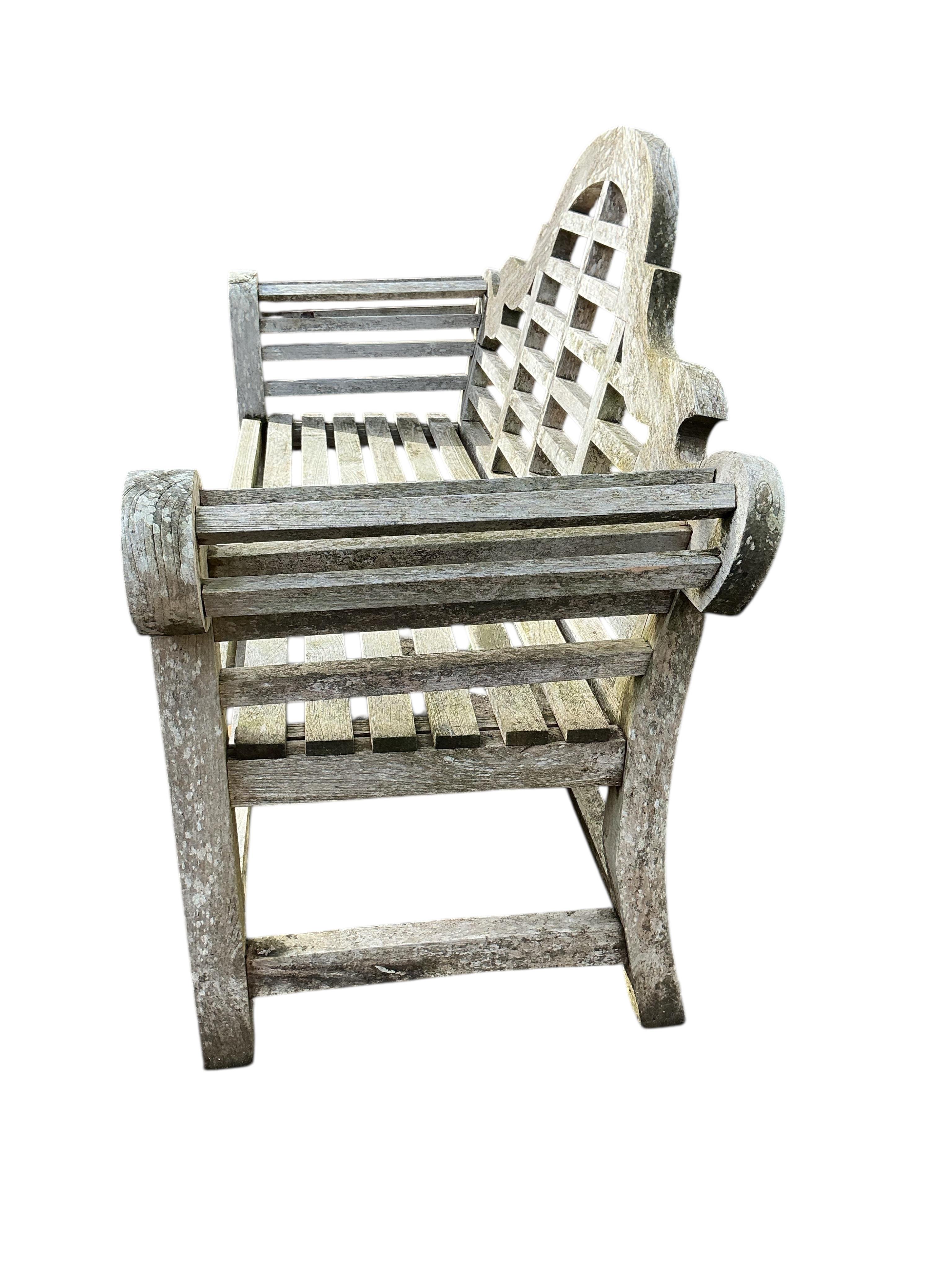 A Lutyens style weathered teak garden bench, width 168cm, depth 55cm, height 106cm